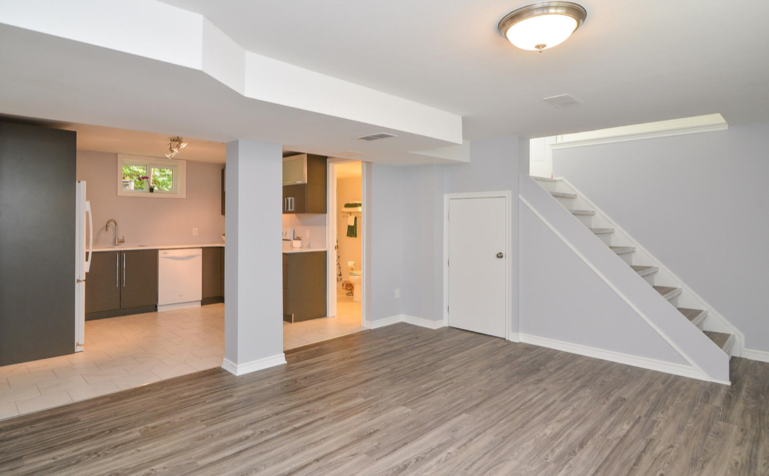 Bright and modern secondary dwelling with a functional kitchen and stylish finishes—custom secondary basement dwelling renovation in Ottawa.